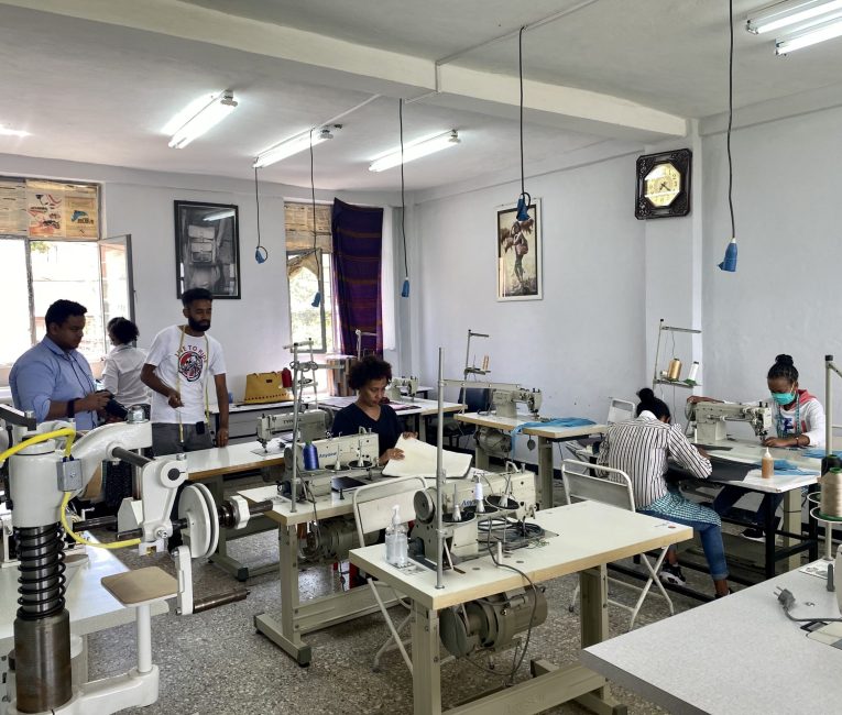 the workers are manufacturing leather products.